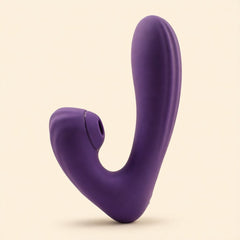 Sucking Sweet in purple silicone standing upright, side view, on a cream ground